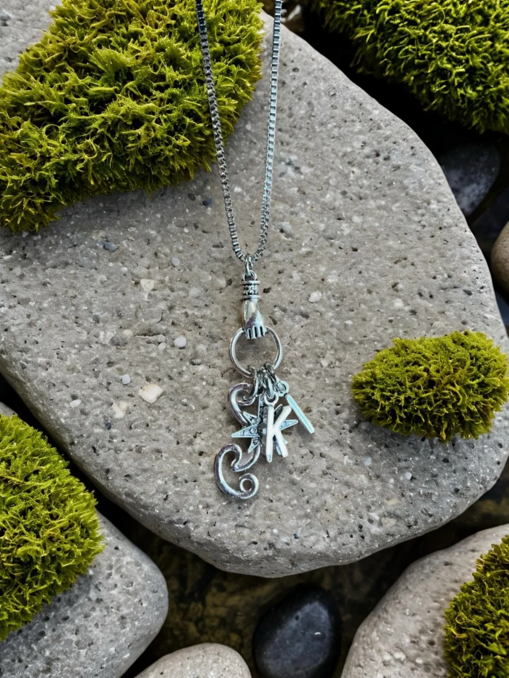 Monk DND necklace with the wind, a star, and KI Dungeons and Dragons jewelry
